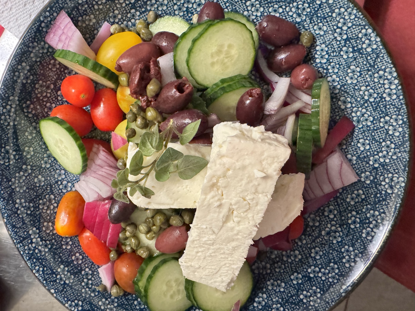 Greek salad on a blue dish, my kitchen